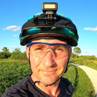 a man wearing a helmet with a camera on it